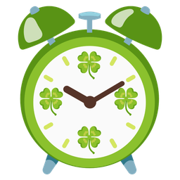 alarm clock and four leaf clover