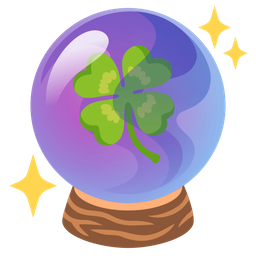 crystal ball and four leaf clover
