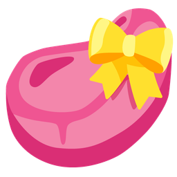 cut of meat and heart with ribbon