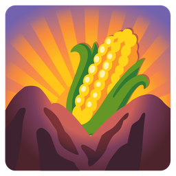 ear of corn and sunrise over mountains
