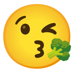 face blowing a kiss and broccoli