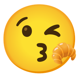 face blowing a kiss and croissant