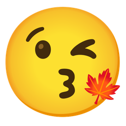 face blowing a kiss and maple leaf