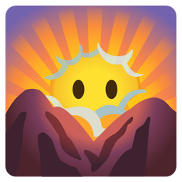 face in clouds and sunrise over mountains