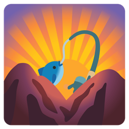 fishing pole and sunrise over mountains