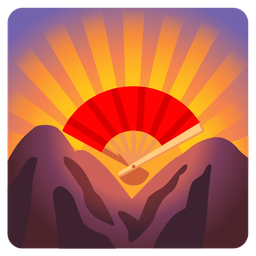 folding hand fan and sunrise over mountains