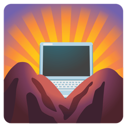 Laptop and Sunrise over mountains