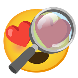 smiling face with heart-eyes and magnifying glass tilted right