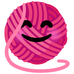 smiling face with smiling eyes and yarn
