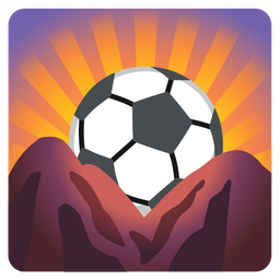 soccer ball and sunrise over mountains