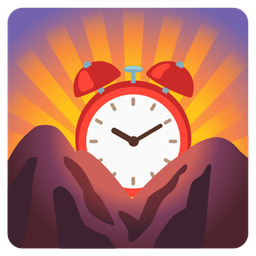 sunrise over mountains and alarm clock