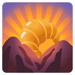 sunrise over mountains and croissant