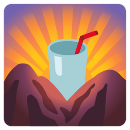 sunrise over mountains and cup with straw