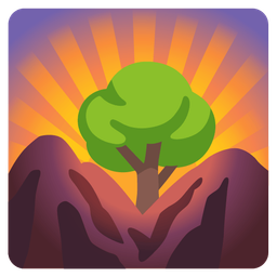 sunrise over mountains and deciduous tree