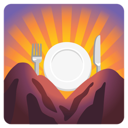 sunrise over mountains and fork and knife with plate