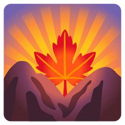 sunrise over mountains and maple leaf