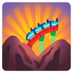 sunrise over mountains and roller coaster