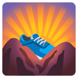 sunrise over mountains and running shoe