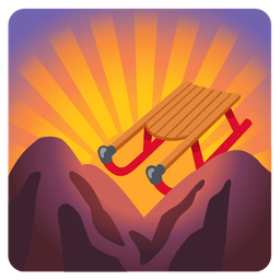 sunrise over mountains and sled