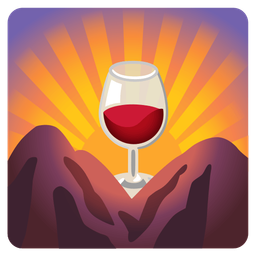 sunrise over mountains and wine glass