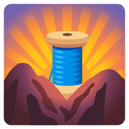 thread and sunrise over mountains